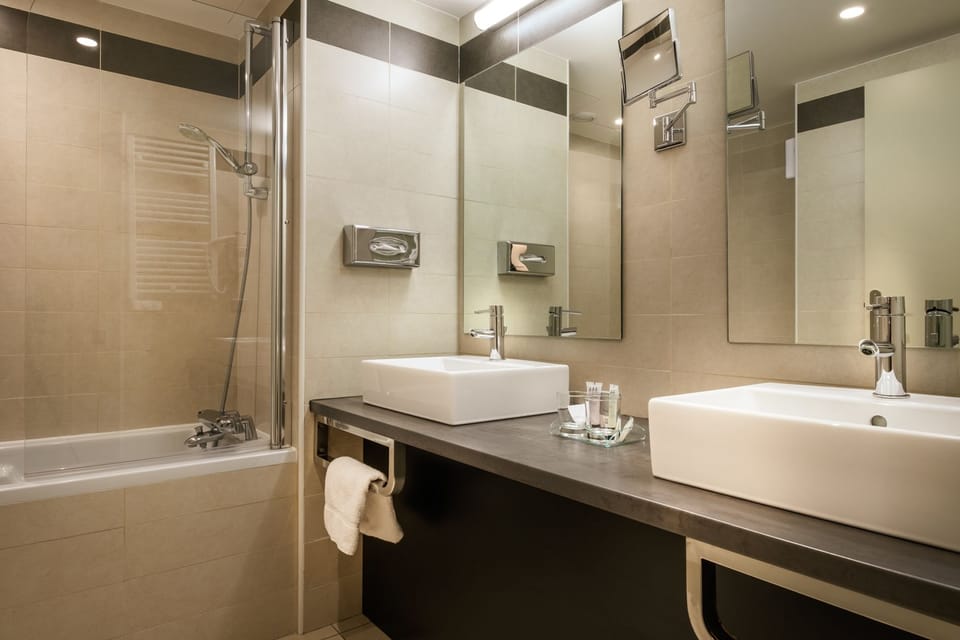 Combined shower/tub, free toiletries, hair dryer, slippers