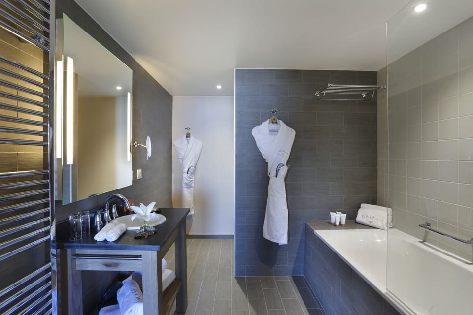 Designer toiletries, hair dryer, bathrobes, slippers