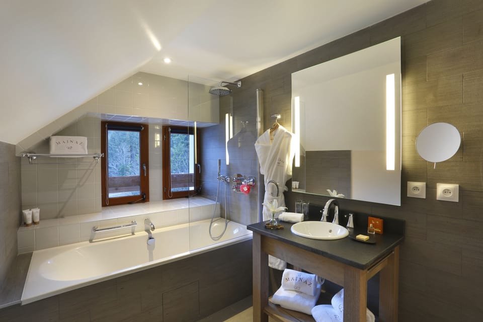 Designer toiletries, hair dryer, bathrobes, slippers