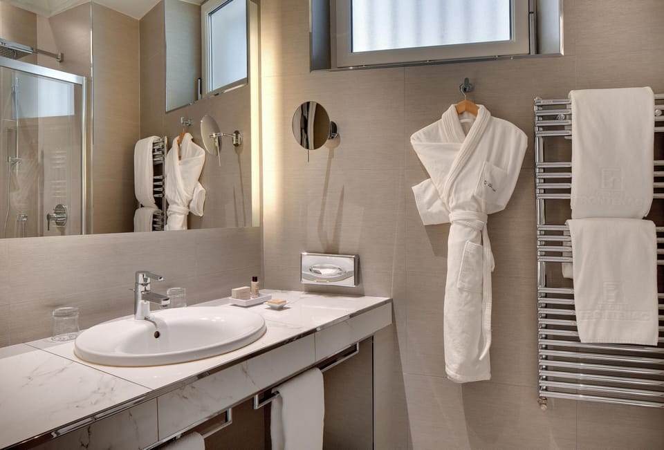 Designer toiletries, hair dryer, bathrobes, slippers