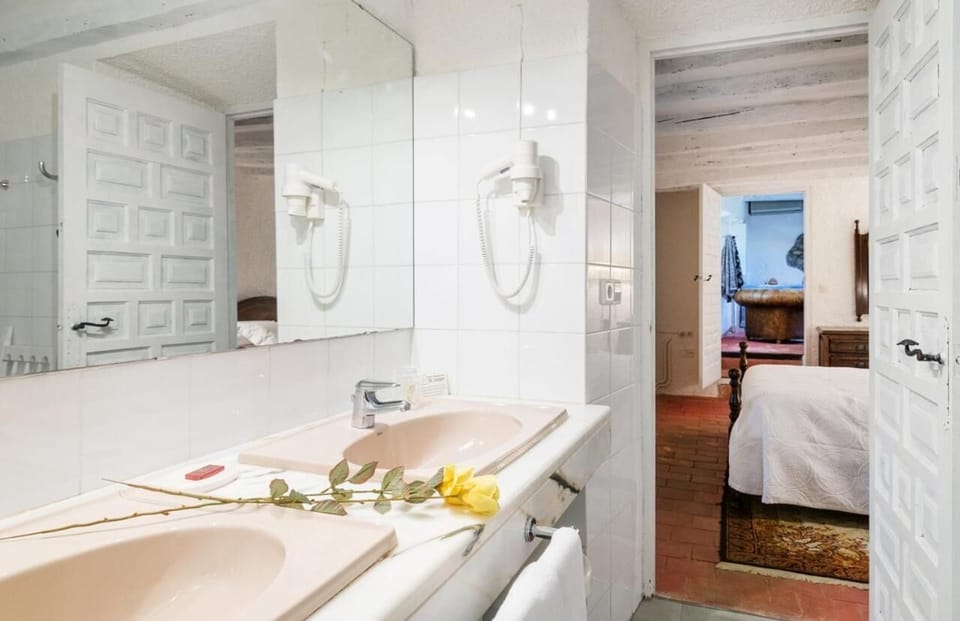 Bathtub, hair dryer, towels, soap