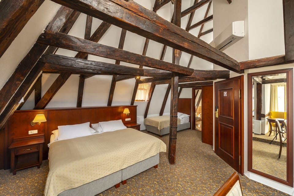Triple Room | Minibar, in-room safe, iron/ironing board, free WiFi