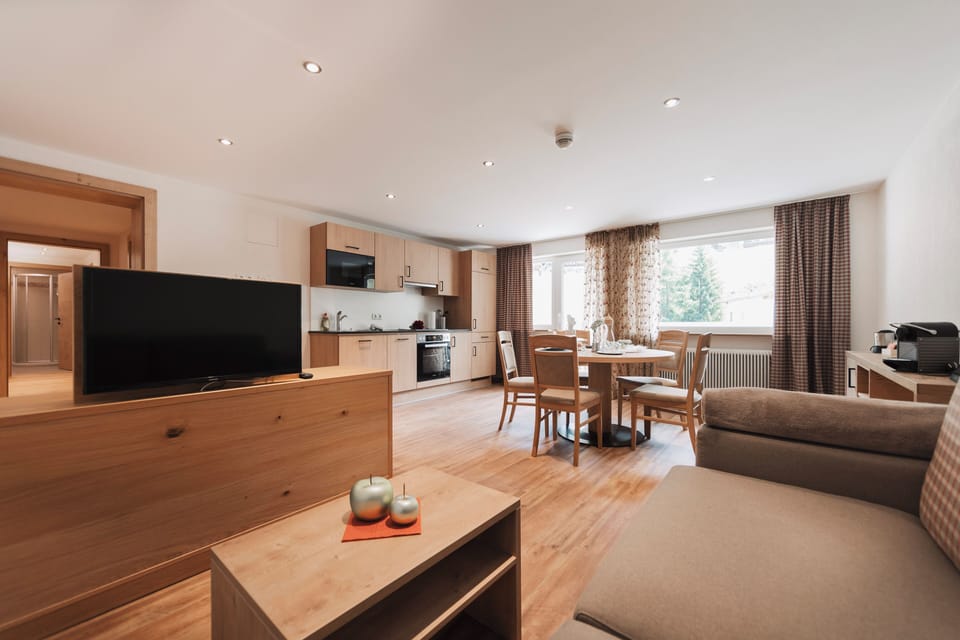 Family Apartment, 2 Bedrooms, Balcony, Mountainside | Living area | 39-inch flat-screen TV with satellite channels, toys