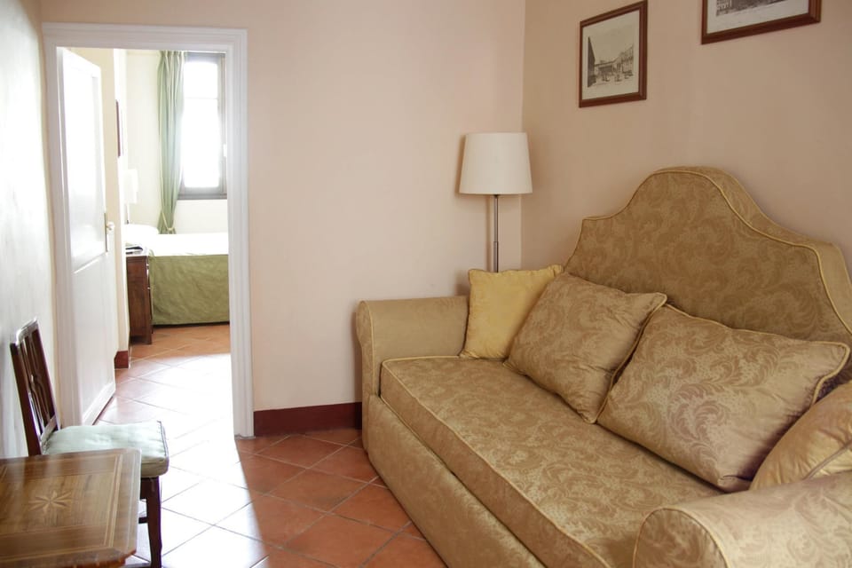 Triple Room | Minibar, in-room safe, individually furnished, desk