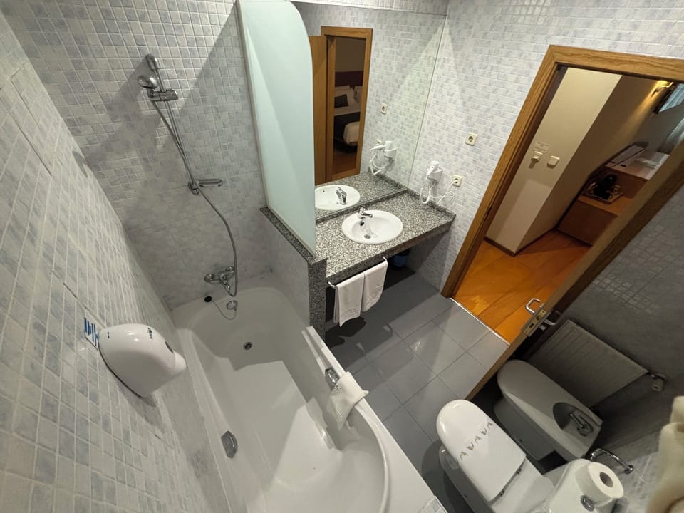 Family Quadruple Room | Bathroom | Deep soaking tub, free toiletries, hair dryer, bidet