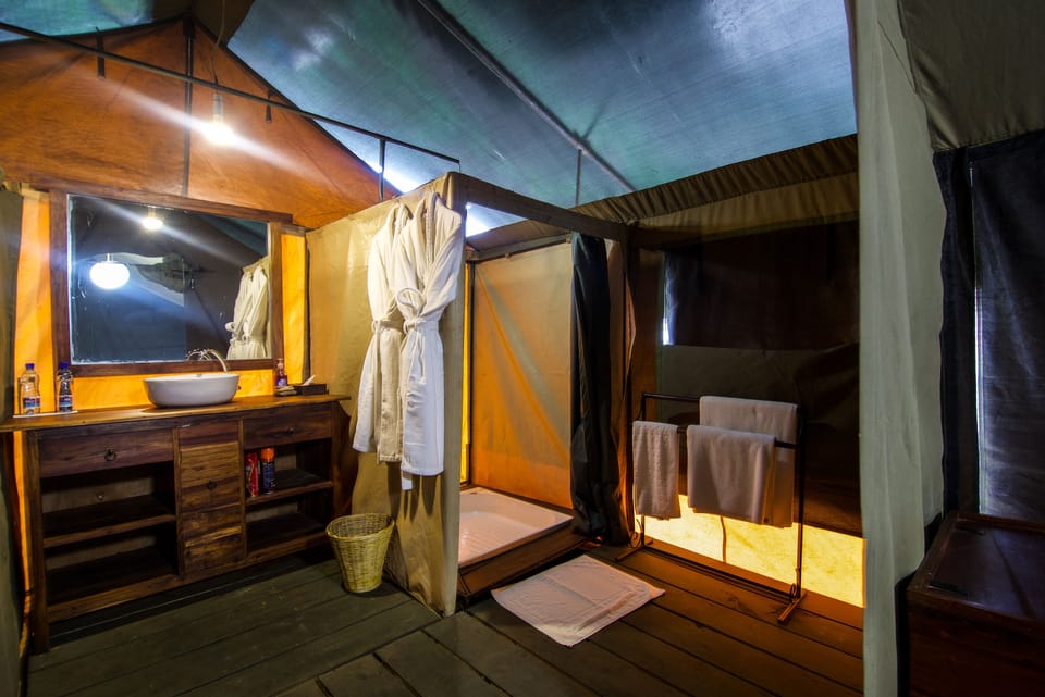 Shower, rainfall showerhead, slippers, towels