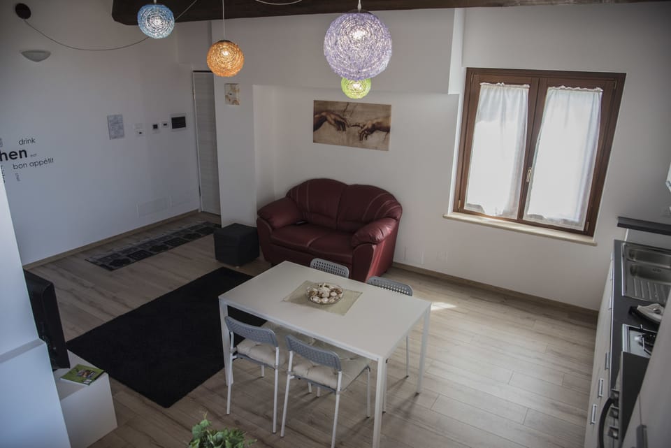 Deluxe Apartment (La Veduta) | Living area | Flat-screen TV