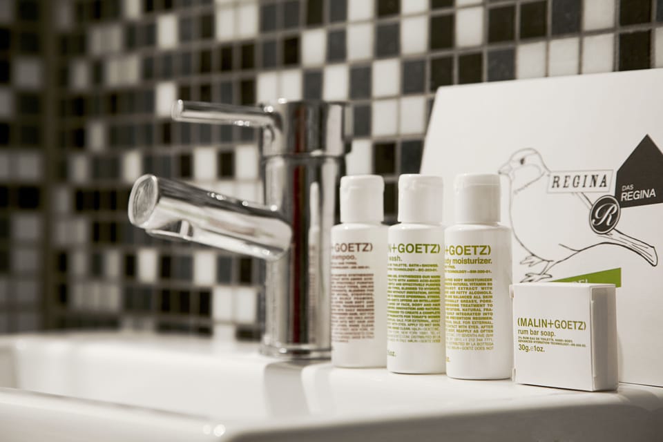 Designer toiletries, hair dryer, towels