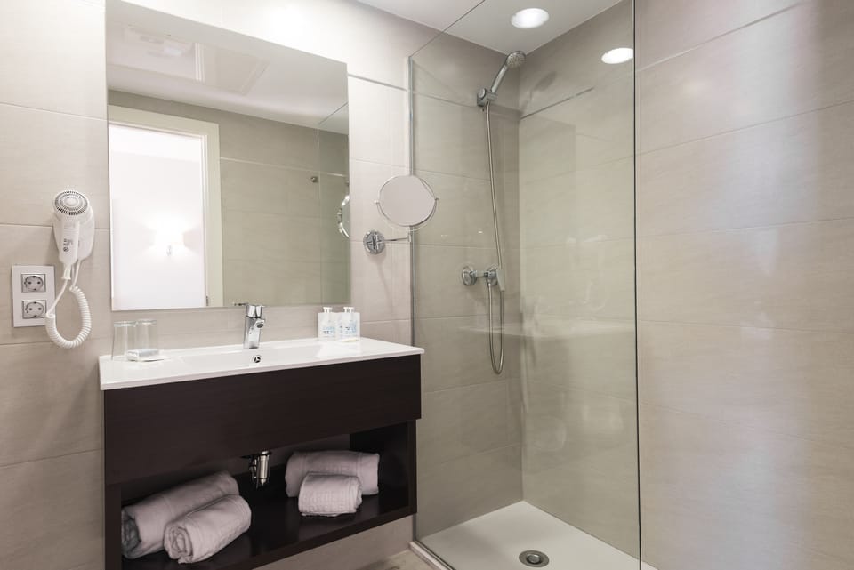 Shower, free toiletries, hair dryer, towels