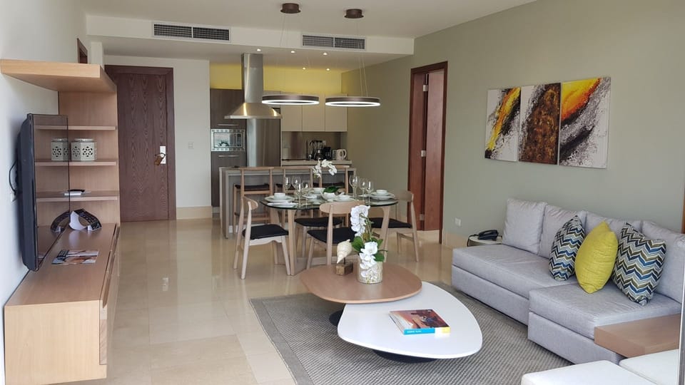 Condo, 1 Bedroom (All Inclusive) | Living room | Flat-screen TV