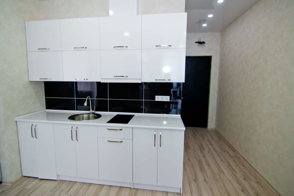 Family Quadruple Room, 1 Bedroom | Private kitchen | Fridge, microwave, stovetop, cookware/dishes/utensils