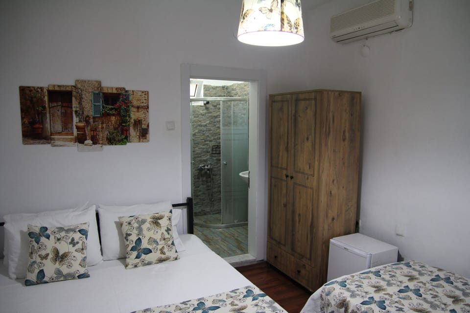 Grand Triple Room | Minibar (some free items), blackout drapes, WiFi (free), bed sheets