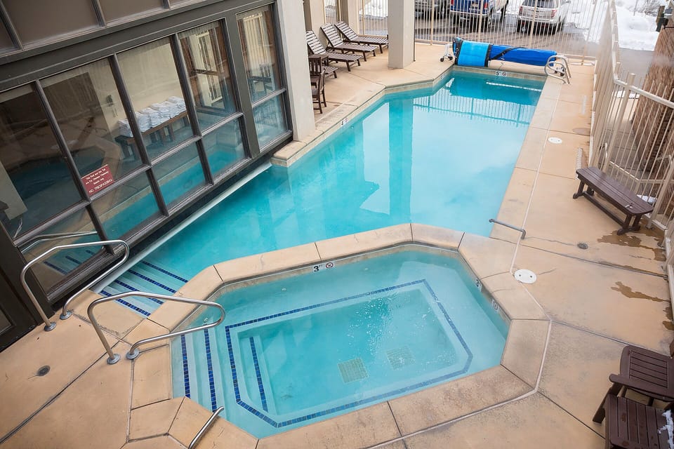 Unwind in your private pool and spa area with comfortable loungers for ultimate relaxation.