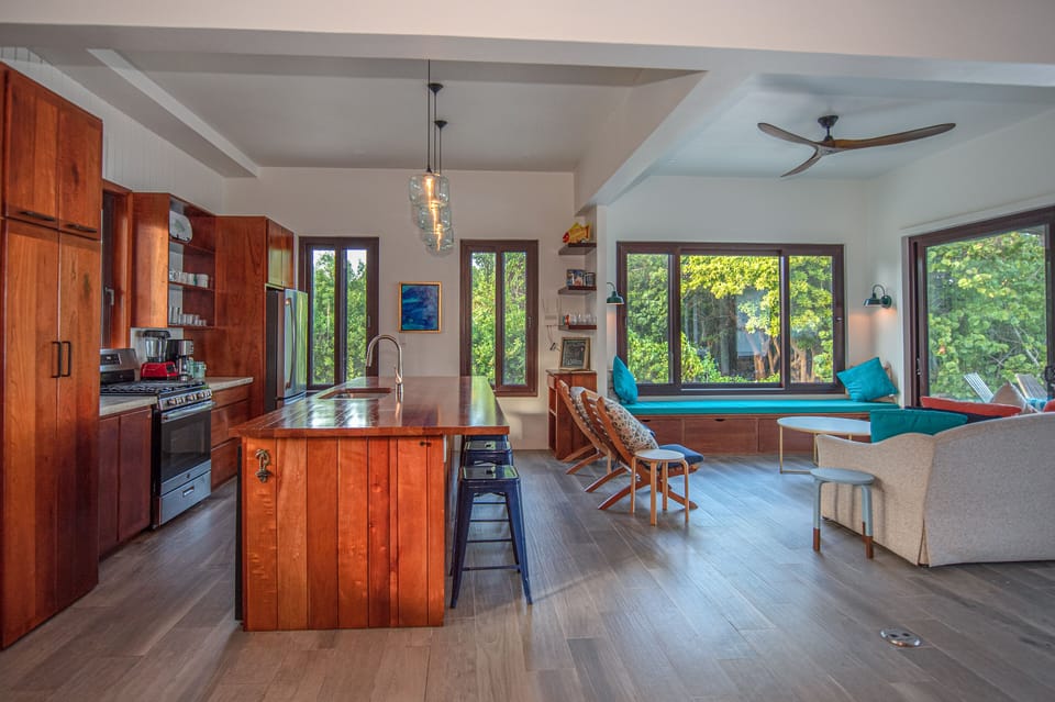 Open kitchen and living with sliding doors that open to the pool and deck!
