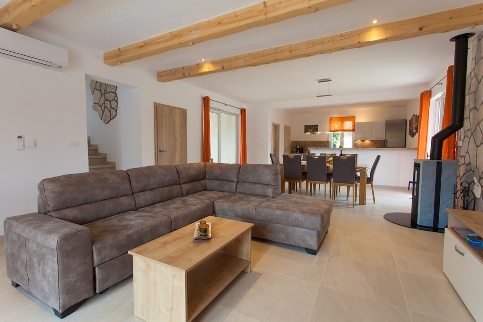 view from living area to dining area - kitchen in background