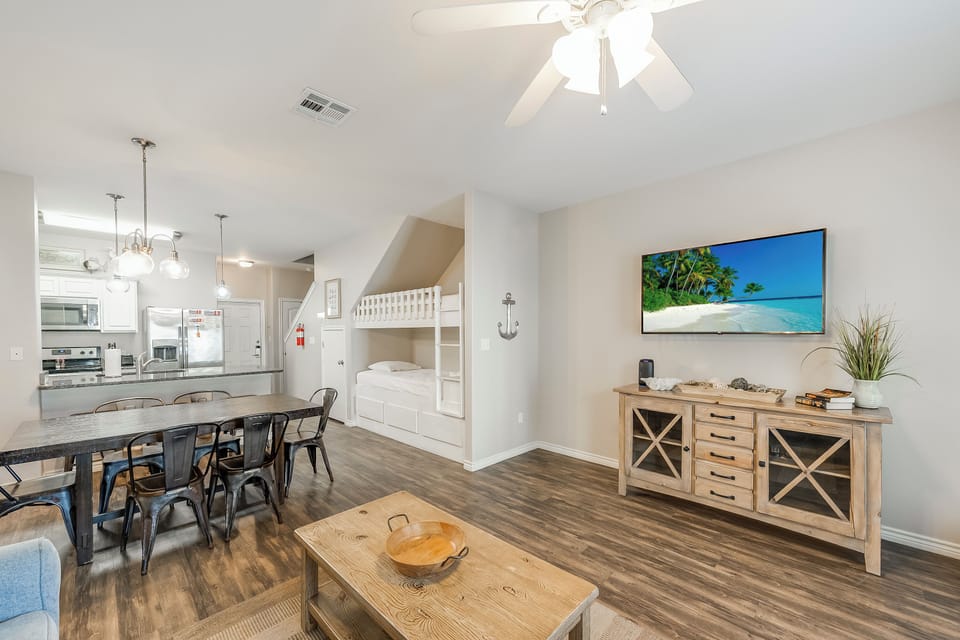 Relax in your open-concept haven with soaring ceilings, built-in bunk beds, and coastal charm throughout every thoughtfully designed detail.