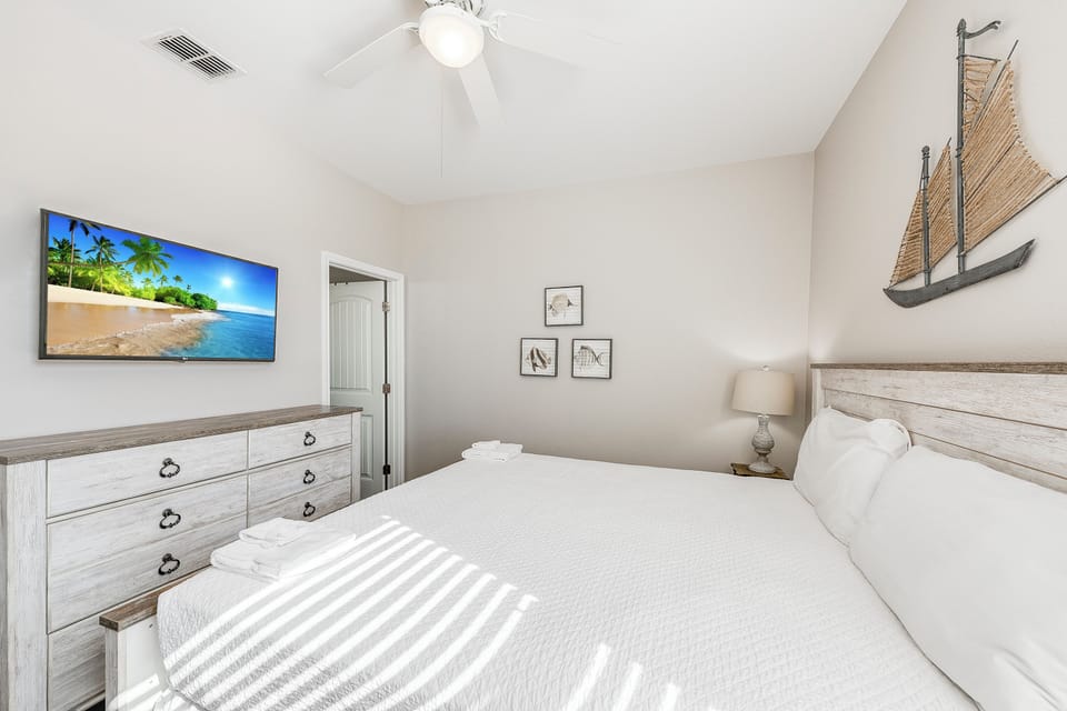 Drift off peacefully in your serene coastal-themed bedroom, where crisp linens and nautical decor create your perfect retreat.