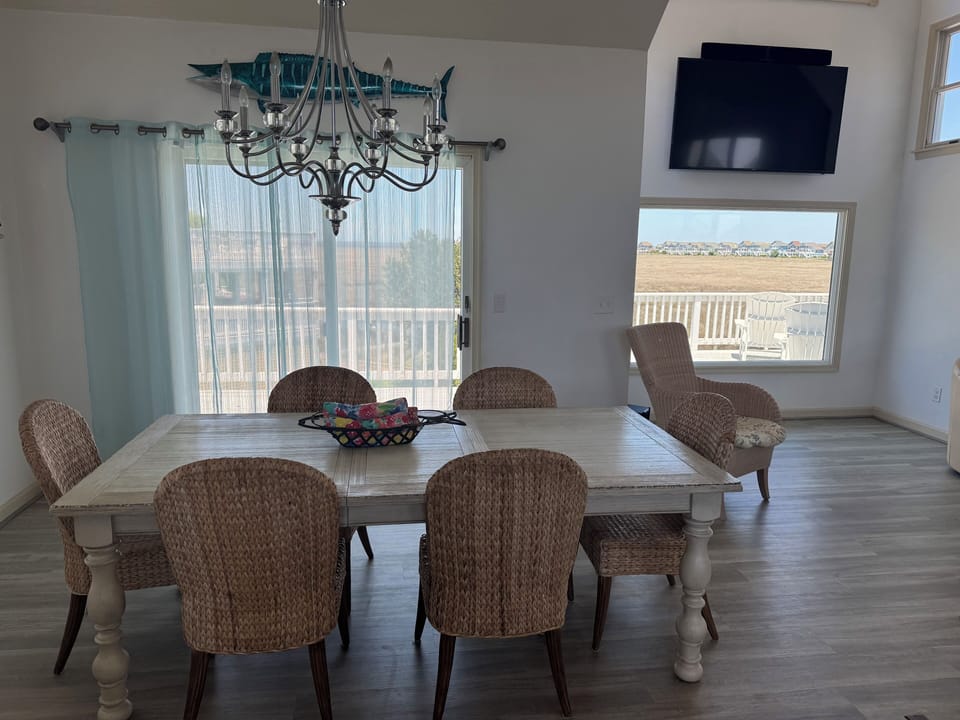 Dinning area with awesome views of jockey ridge, the sound, boats, parasailing!