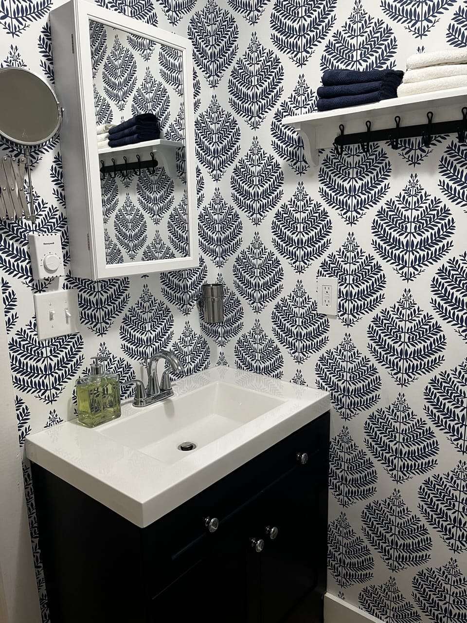 Updated bath. Shower only ( no tub). Hairdryer and extra bath linens provided.