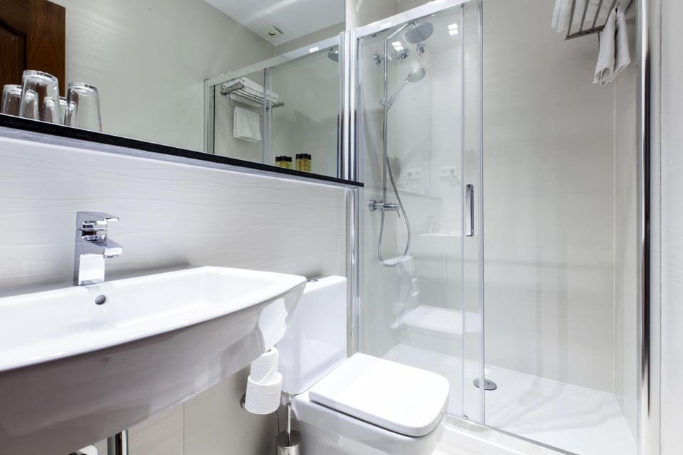 Shower, rainfall showerhead, hair dryer, towels