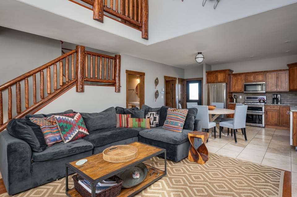 Open concept living area leads into the kitchen and dining area