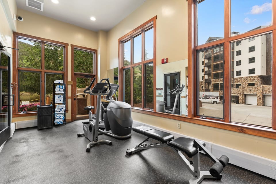 Stay active during your mountain getaway in this bright fitness center with modern equipment and beautiful views of the surrounding trees and landscape.