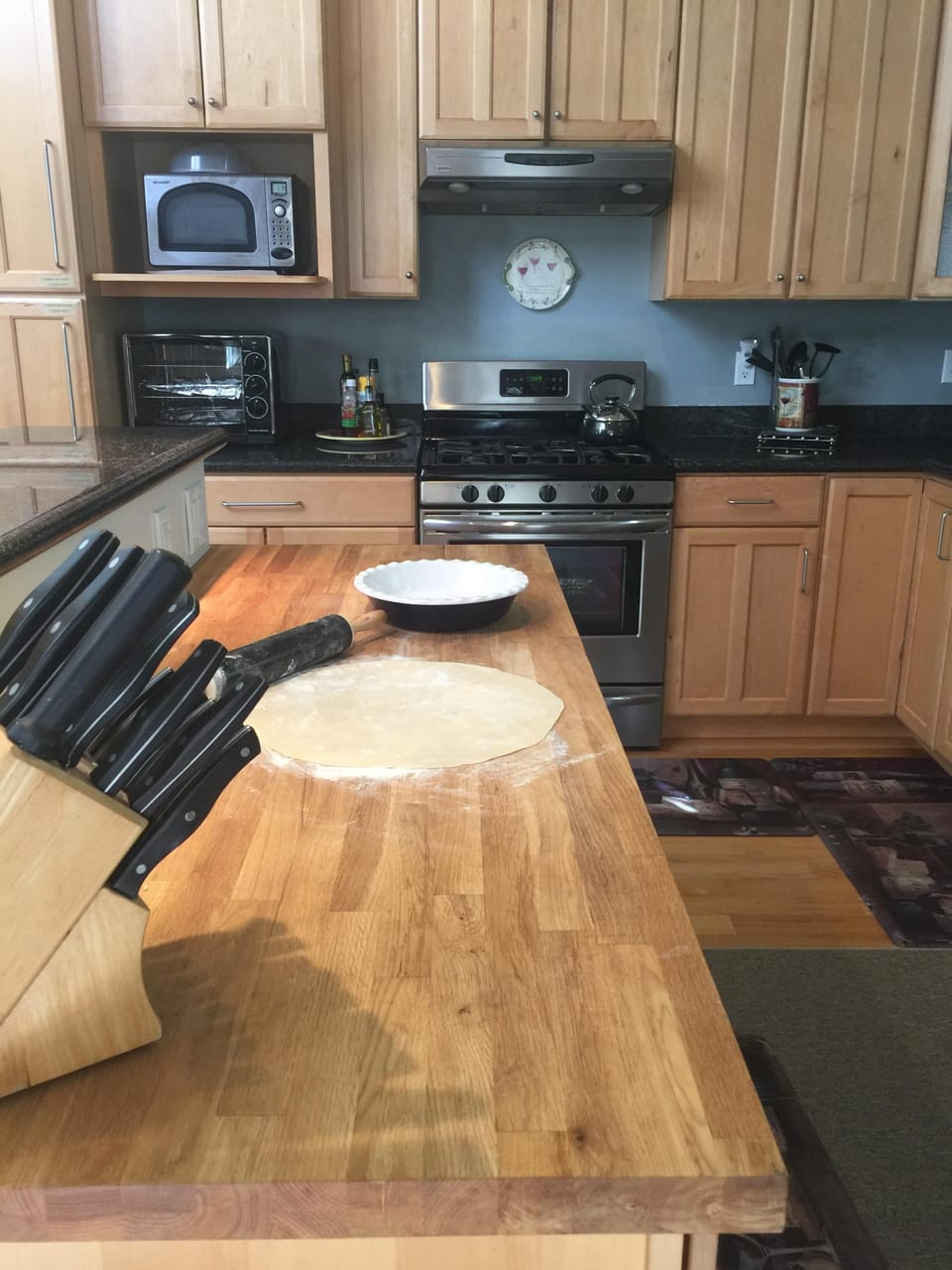 Rolling a Pie Crust on the Kitchen Butcher Block  Island Fun to Cook Together