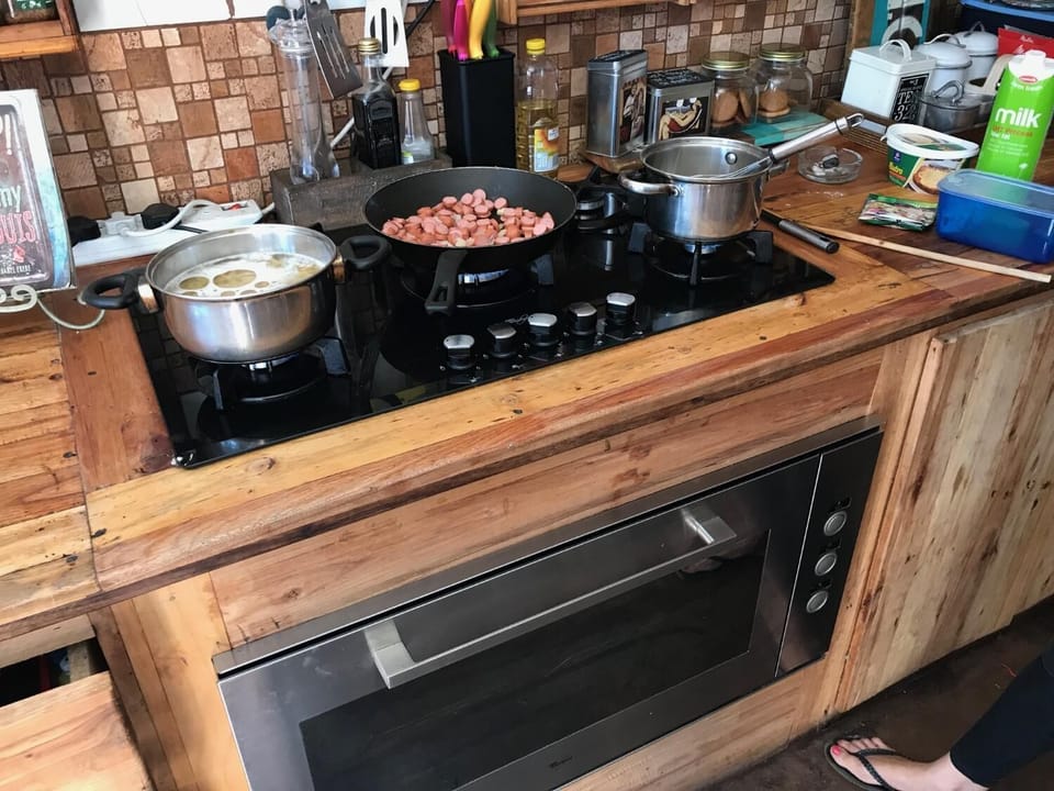 Coffee/tea maker, fridge, microwave, cookware/dishes/utensils