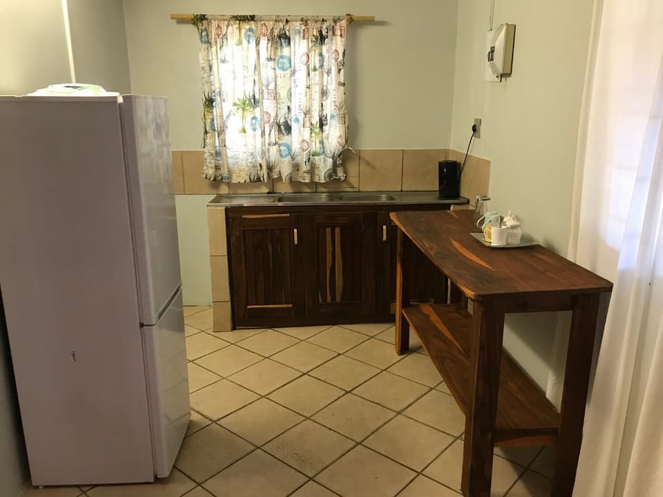 Coffee/tea maker, fridge, microwave, cookware/dishes/utensils