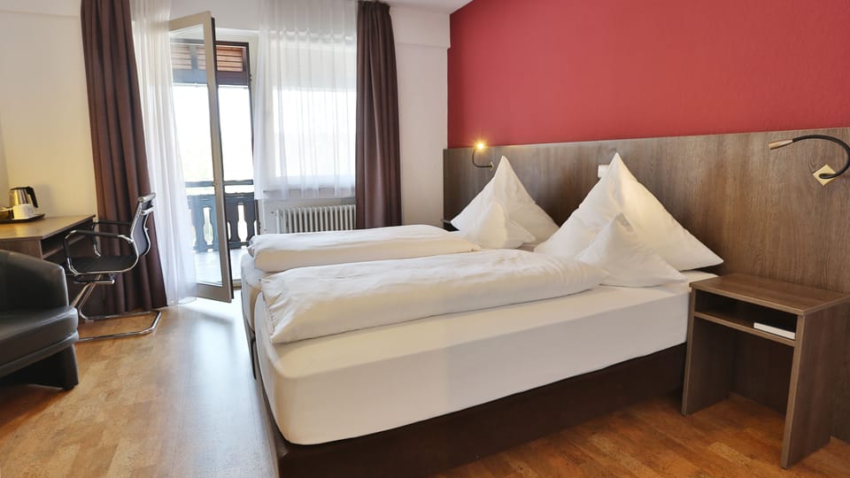 Double or Twin Room | Desk, blackout drapes, cribs/infant beds, rollaway beds
