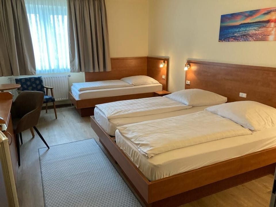 Triple Room | Desk, blackout drapes, iron/ironing board (on request), WiFi (free)