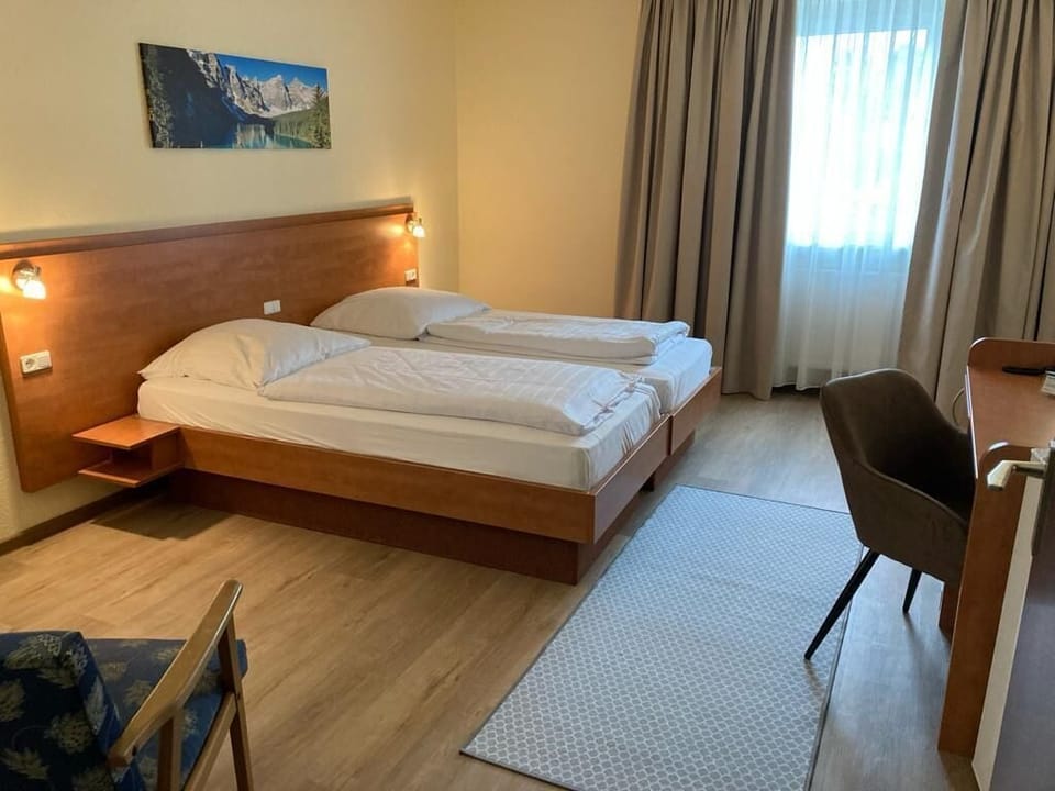 Economy Double Room | Desk, blackout drapes, iron/ironing board (on request), WiFi (free)