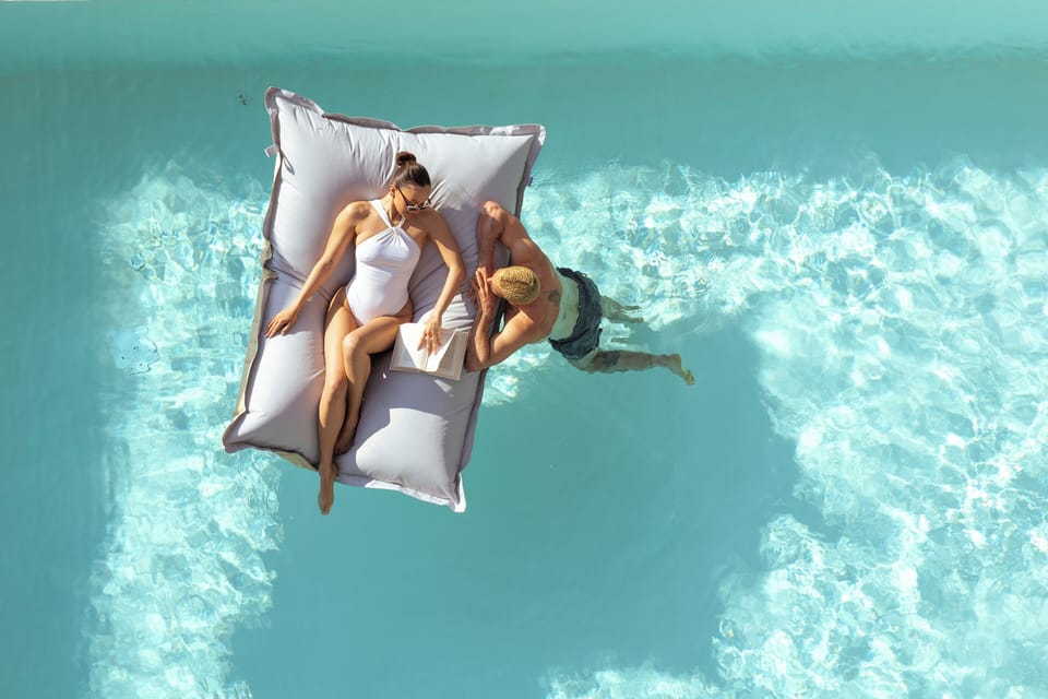 Seasonal outdoor pool, an infinity pool, pool umbrellas, sun loungers