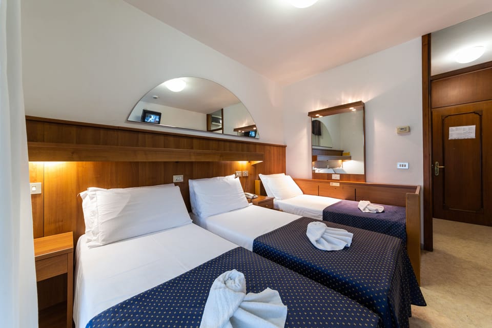 Triple Room | Pillowtop beds, minibar, in-room safe, desk