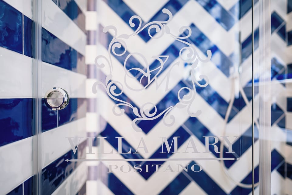 Junior Suite, Terrace, Partial Sea View | Bathroom | Separate tub and shower, rainfall showerhead, designer toiletries