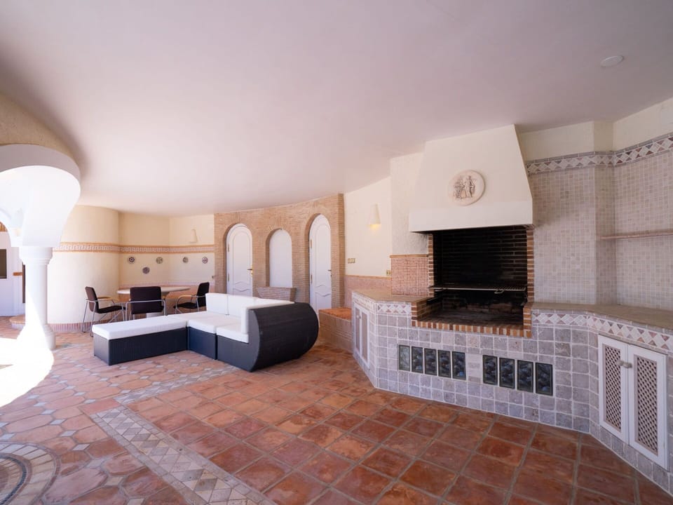 Wood, Interior Design, Flooring, Living Room, Floor, Hall, Hearth, Building, Hardwood, House