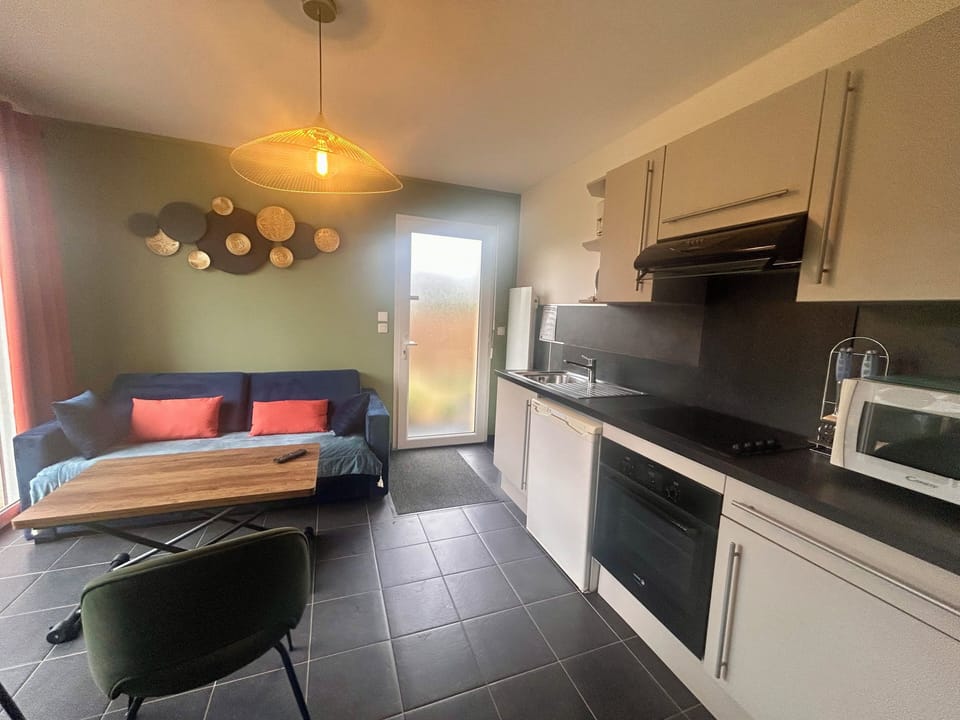 Deluxe Double Room, 1 Bedroom, Kitchen, Garden Area | Living area | 100-cm flat-screen TV with satellite channels, TV, offices