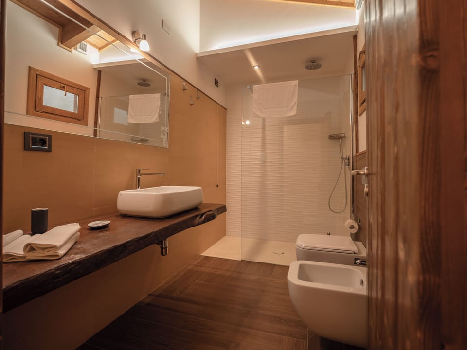 Luxury Chalet, 1 Bedroom, Park View | Bathroom | Shower, rainfall showerhead, free toiletries, hair dryer