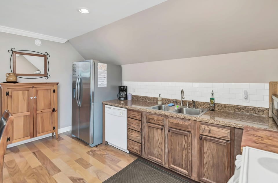 Refrigerator with ice maker/water, dish washer, coffee maker with coffee.