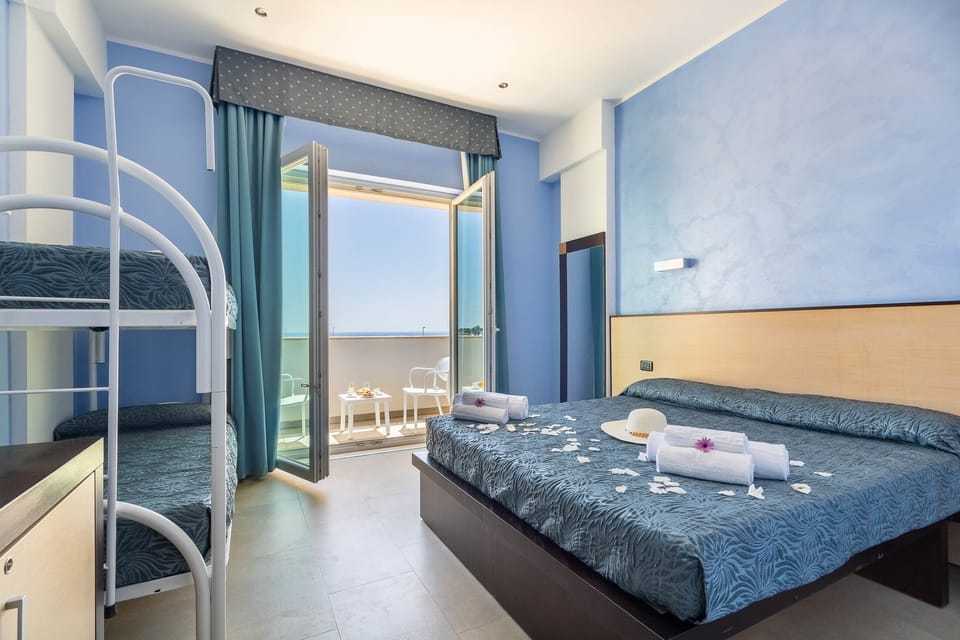 Family Room, Balcony, Sea View | Minibar, in-room safe, desk, soundproofing