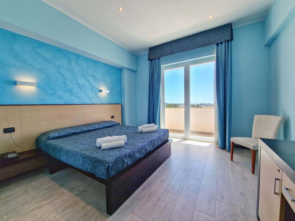 Double or Twin Room, Balcony, Sea View | Minibar, in-room safe, desk, soundproofing