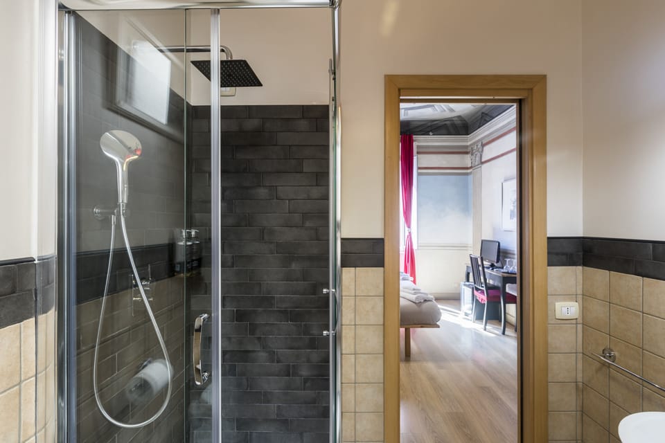 Shower, rainfall showerhead, free toiletries, hair dryer