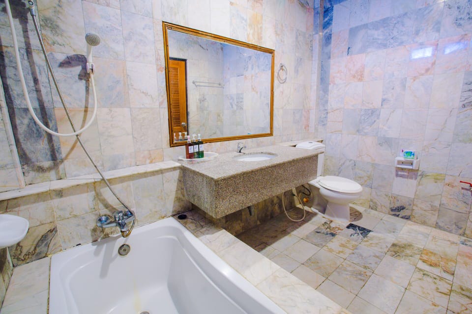 Family Room A/C (2 Double Bed) | Bathroom | Shower, free toiletries, hair dryer, towels