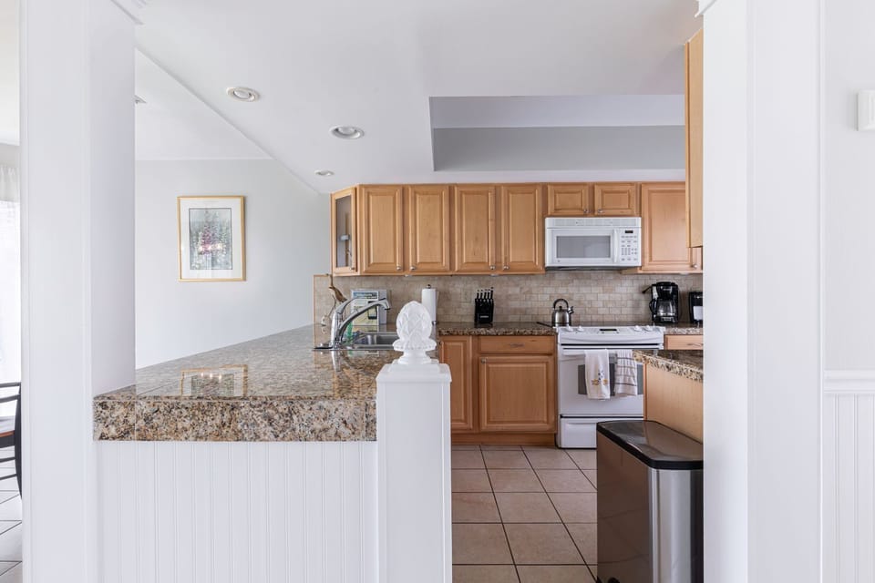 Features include gleaming granite counters, and new appliances.