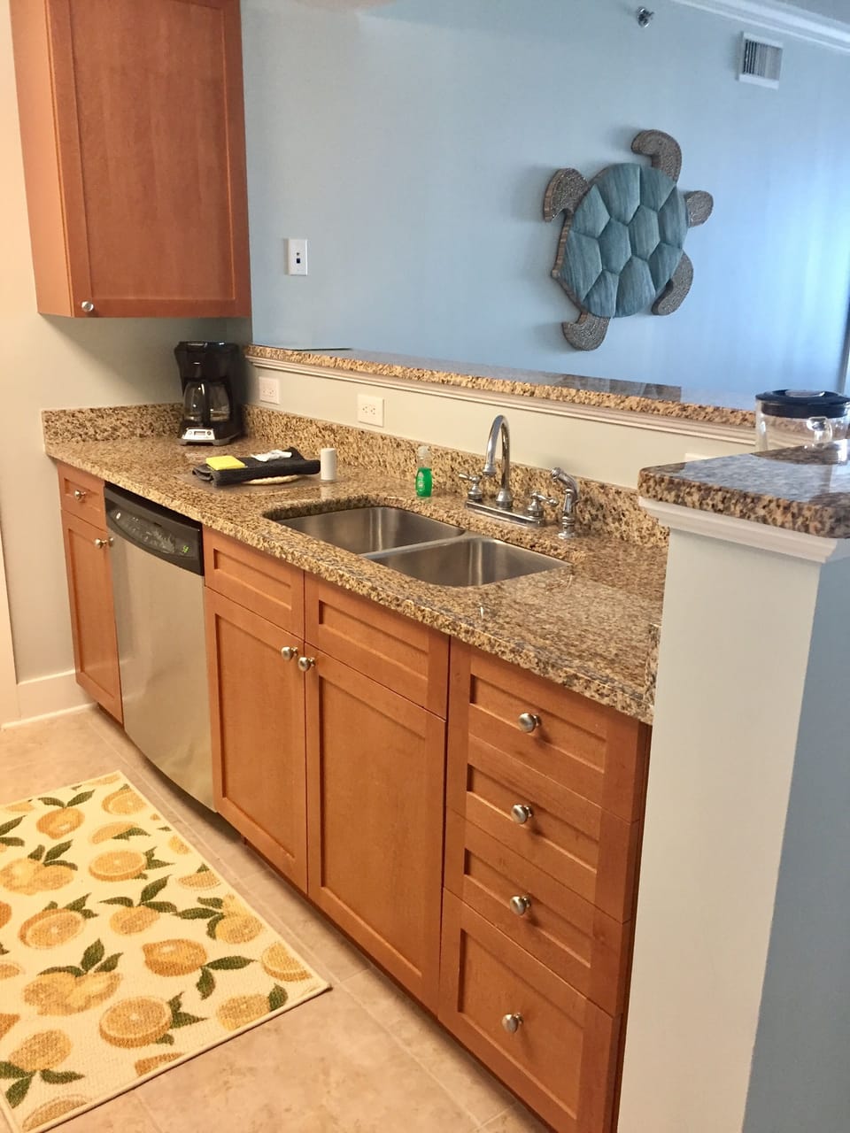  Kitchen has stainless steel appliances and granite countertops.