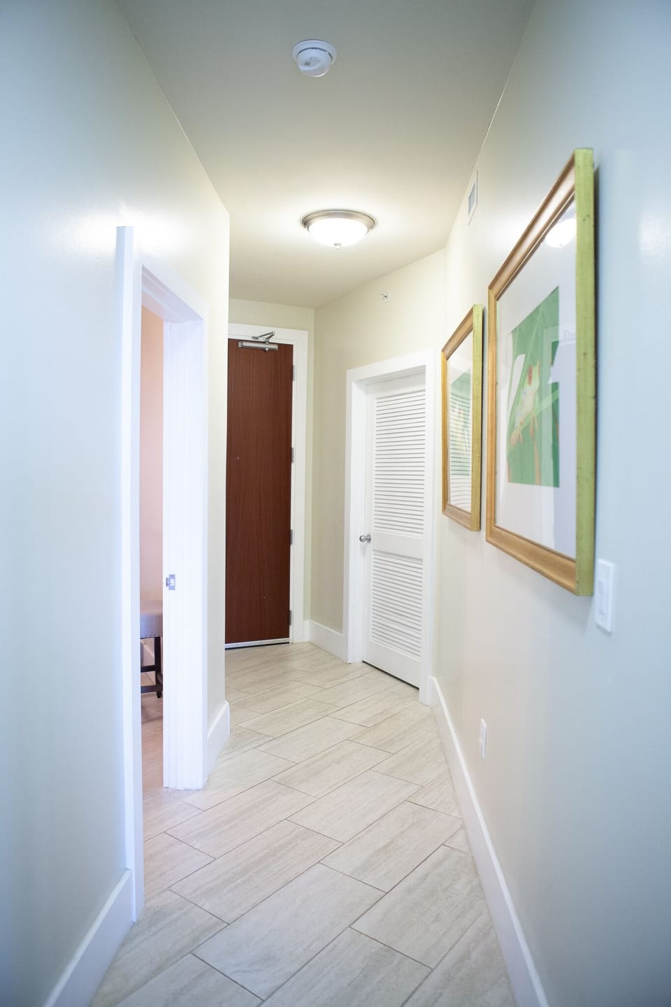 Hallway on the way out. Door left=Guest Room, Door on right=Laundry