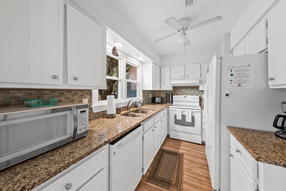 The kitchen has granite counter tops
