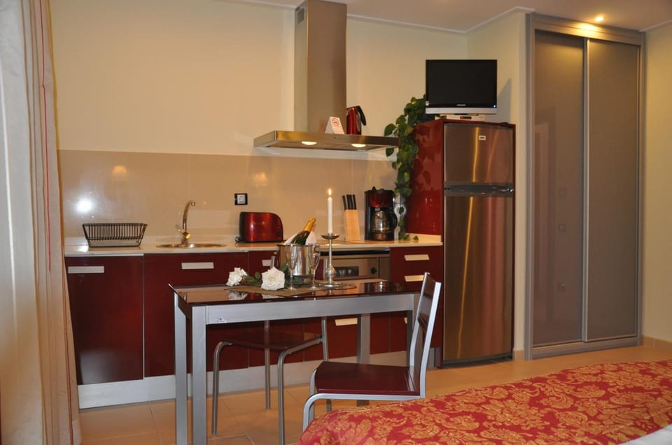 Fridge, microwave, stovetop, coffee/tea maker