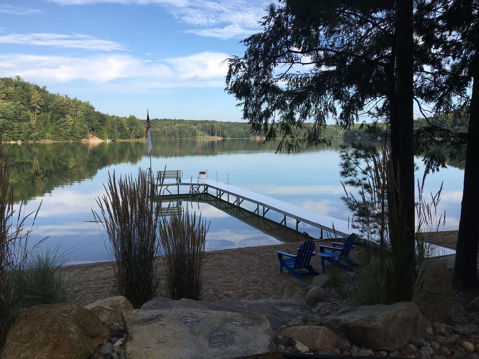 Stairs to the beach and dock. Adirondack Chairs and folding chairs included.