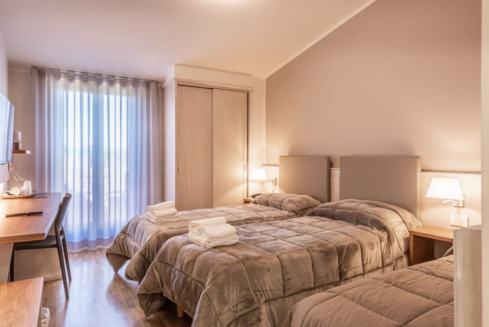 Classic Triple Room | Minibar, in-room safe, individually furnished, desk